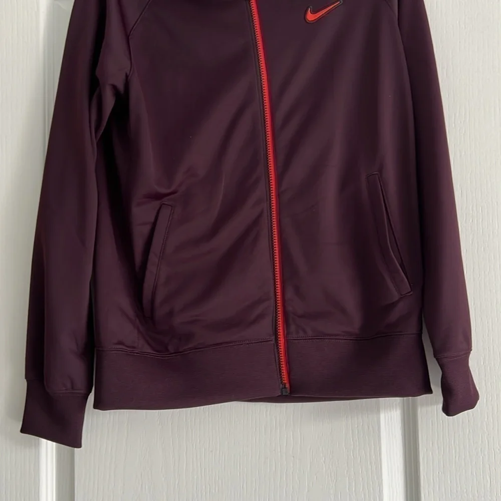 Maroon Nike Jacket size XL Youth black and orange detailing fits womens M/L